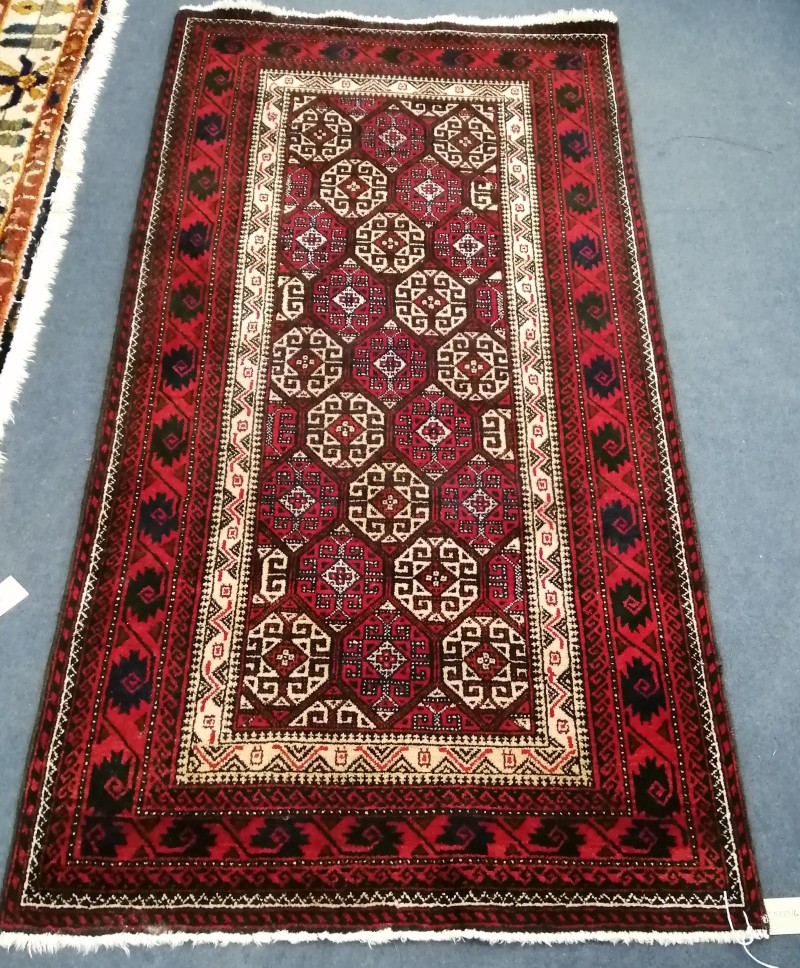 An Afghan rug, 147 x 77cm